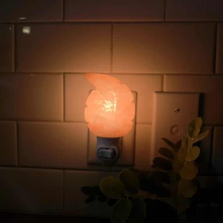 Himalayan Salt Leaf Night Light glowing warm orange – Plug-in pink salt lamp shaped like a leaf by Premier Halite – Soft light for bedroom, nursery, or hallway – USA and Canada