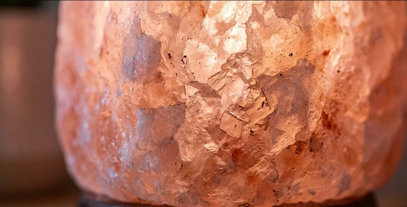 Close up view of the rough and natural texture of a genuine Himalayan salt crystal